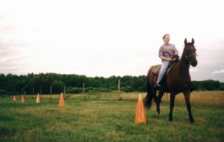 Practicing guiding a horse around traffic cones