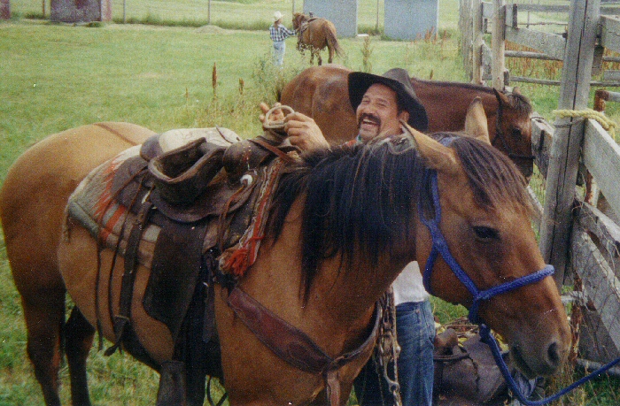 One of the Pitzen brothers saddling up