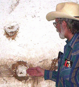 Holes kicked through a stable wall