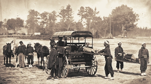 Army ambulance being loaded