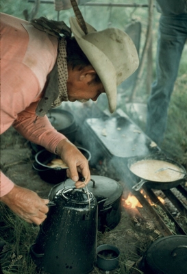Cowboy pouring coffee