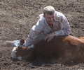 Cowboy with a piggin' string in his teeth