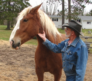 Cowboy Bob begins to put pressure under a horse's head
