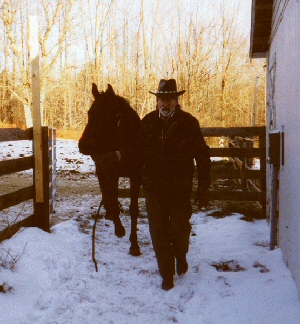 Cowboy Bob leading a formerly unruly horse